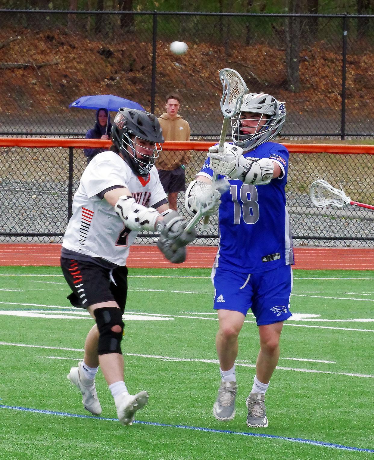 Southeastern's Jacob Lehan manages to get off a pass while being covered by Oliver Ames' Ryan Jaco on Tuesday, April 19, 2022.