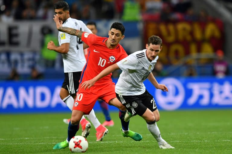 Germany's midfielder Sebastian Rudy (R) vies with Chile's midfielder Pablo Hernandez during the 2017 Confederations Cup group B football match between Germany and Chile, a game that ended in a tie, at the Kazan Arena Stadium in Kazan