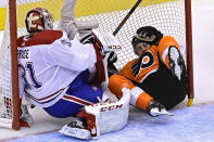 Philadelphia Flyers' Derek Grant (38) crashes into Montreal Canadiens goaltender Carey Price (31) during the first period of an NHL Eastern Conference Stanley Cup hockey playoff game in Toronto, Wednesday, Aug. 12, 2020. (Frank Gunn/The Canadian Press via AP)