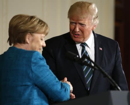 U.S. President Donald Trump and German Chancellor Angela Merkel shake hands at the conclusion of their joint news conference in the East Room of the White House in Washington, U.S., March 17, 2017. REUTERS/Joshua Roberts