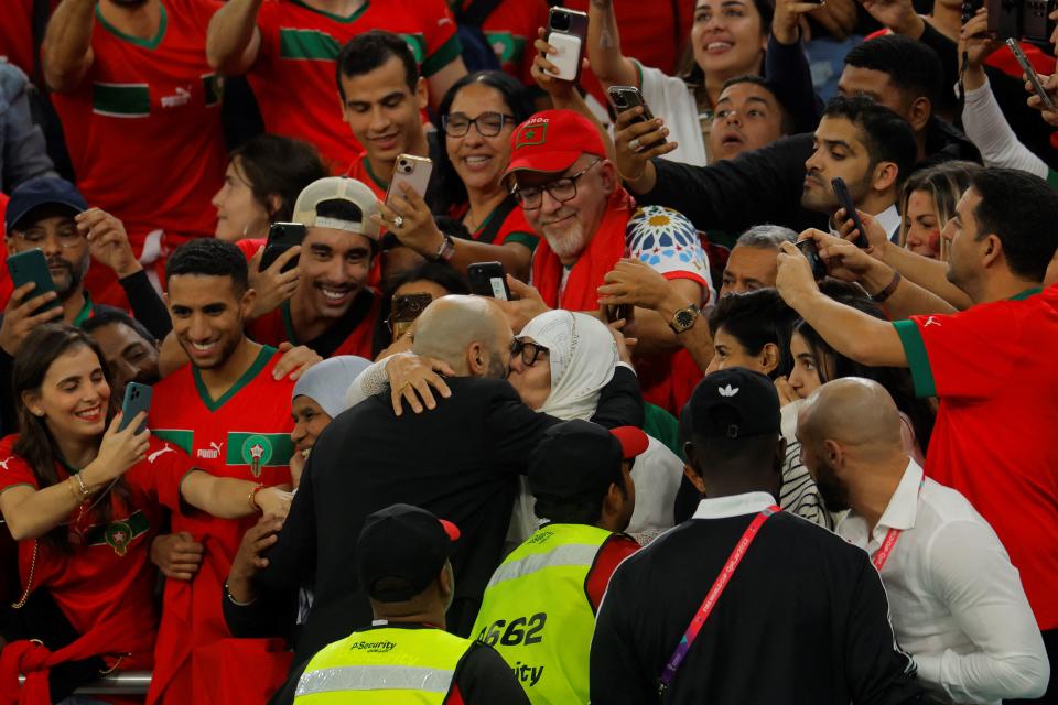 Morocco's coach #00 Walid Regragui (C-L) celebrates after winning the Qatar 2022 World Cup quarter-final football match between Morocco and Portugal at the Al-Thumama Stadium in Doha on December 10, 2022. (Photo by Odd ANDERSEN / AFP) (Photo by ODD ANDERSEN/AFP via Getty Images)