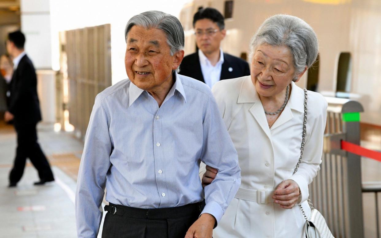 Emperor Akihito and Empress Michiko at Tokyo Station in August. The Emperor is due to abdicate in April next year - The Asahi Shimbun