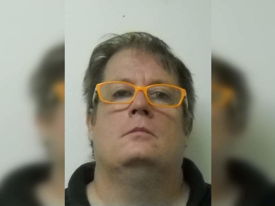 Saskatchewan RCMP have issued a Canada-wide arrest warrant for Michael Gordon Jackson, who is accused of abducting his daughter to prevent her from getting vaccinated against the coronavirus. Police describe Jackson as weighing about 250 pounds with blue eyes and dark brown hair. He typically wears glasses.  (Submitted by RCMP - image credit)