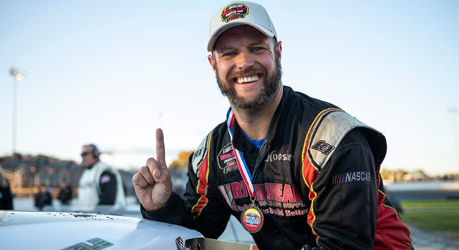 Eric Goodale, driver of #58 GAF Roofing Modified poses for a photo after winning the Phoenix Communications 150 for the Whelen Modified Tour at Thompson Speedway Motorsports Park on October 9, 2022 in Thompson, Connecticut. (Rachel O‘Driscoll/NASCAR)