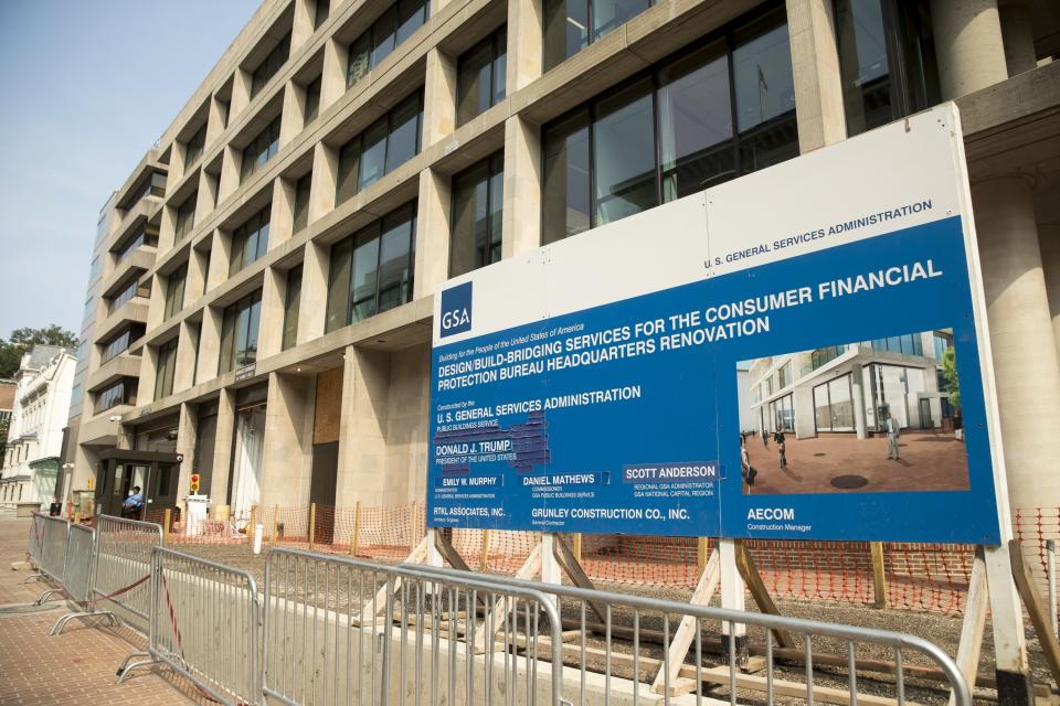 FILE - In this Aug. 27, 2018, file photo, a patched sign stands at the construction site for the Consumer Financial Protection Bureau's new headquarters in Washington. California created what supporters called its own nation-leading, state-level version of the federal Consumer Financial Protection Bureau after critics said the Trump administration significantly weakened national protections, Friday, Sept. 25, 2020. The legislation that Gov. Gavin Newsom signed into law changes the existing Department of Business Oversight into the Department of Financial Protection and Innovation in what proponents said is the first such move by any state. (AP Photo/Andrew Harnik, File)