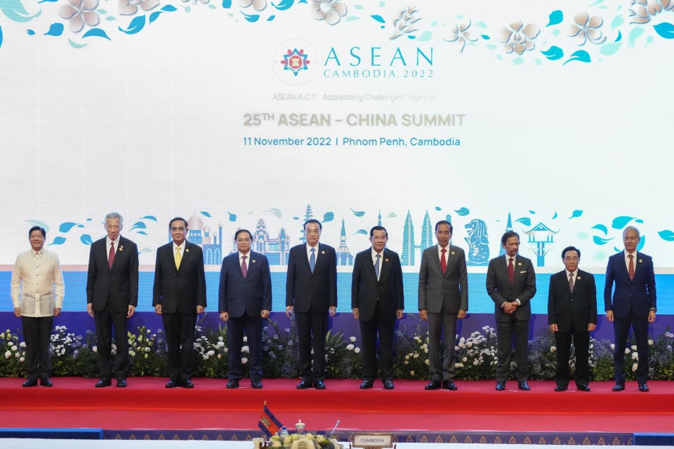 From left to right; Philippine's President Ferdinand Marcos, Jr., Singapore's Prime Minister Lee Hsien Loong, Thailand's Prime Minister Prayuth Chan-ocha, Vietnam's Prime Minister Pham Minh Chinh, Chinese's Premier Li Keqiang, Cambodia Prime Minister Hun Sen, Indonesia's President Joko Widodo, Brunei's Sultan Hassanal Bolkiah, Laos Prime Minister Phankham Viphavanh, and Malaysia Speaker of the House of Representatives Azhar Azizan Harun pose during group photo of the ASEAN - China Summits (Association of Southeast Asian Nations) in Phnom Penh, Cambodia, Friday, Nov. 11, 2022. (AP Photo/Heng Sinith)