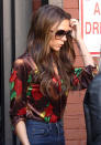 <b>Victoria Beckham</b><br><br> Mrs Beckham changed things up by swapping plain colours for print. She complimented this new look with blue skinny jeans and (as ever) a pair of oversized sunglasses. <br><br>© REX