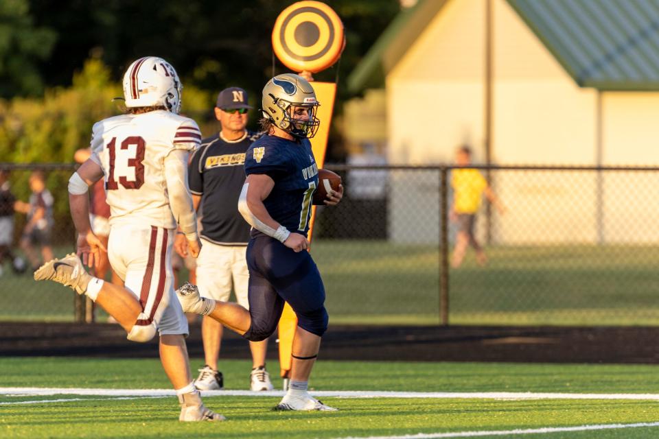 Niles' Paul Hess (10) runs with the ball for a touchdown during the Buchanan-Niles high school football game on Thursday, September 01, 2022, at Sylvester Stadium in Berrien Springs, Michigan.