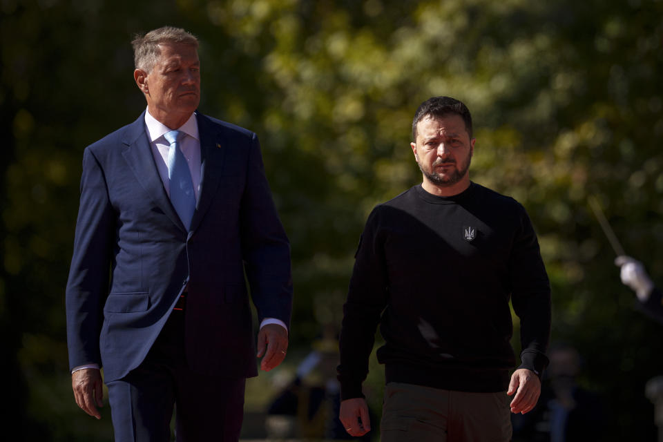 Ukraine's President Volodymyr Zelenskyy, right, attends a welcoming ceremony at the Cotroceni Presidential Palace together with Romanian President Klaus Iohannis, in Bucharest, Romania, Tuesday, Oct. 10, 2023. (AP Photo/Andreea Alexandru)