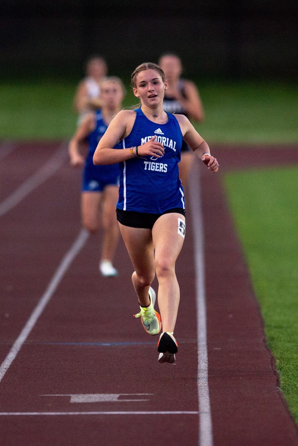 Memorial’s Carson Parks finishes in first place for the 3200 meter run during the 2023 Southern Indiana Athletic Conference Girls Track & Field meet at Central High School in Evansville, Ind., Wednesday, May 3, 2023.