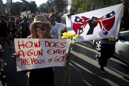 People take part in "Black Lives Matter" march around Emanuel African Methodist Episcopal Church in Charleston, June 20, 2015. REUTERS/Carlo Allegri