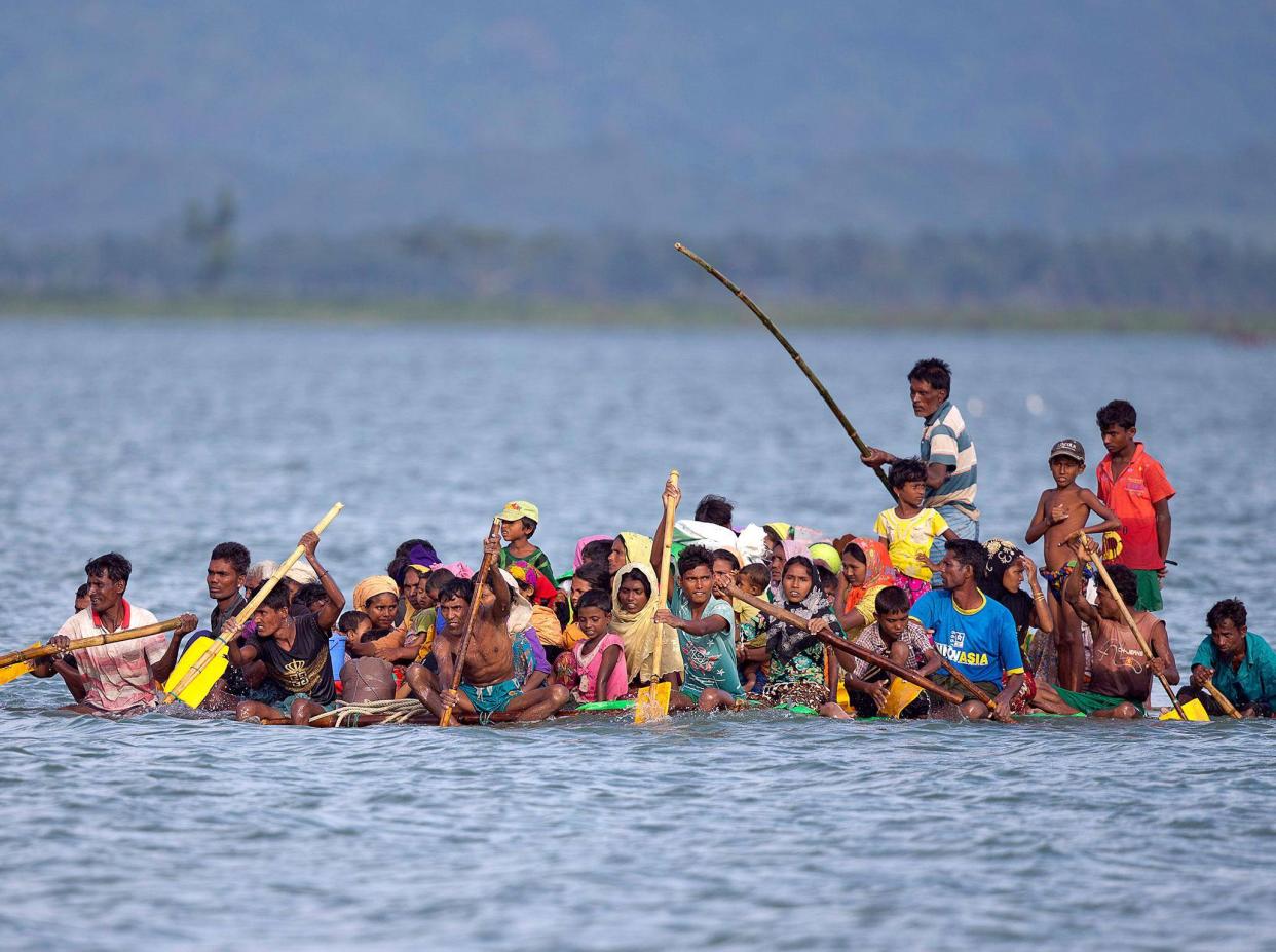 Rohingya Muslims who have fled to Bangladesh on makeshift rafts have accused the Burmese military of murder and rape: AP Images