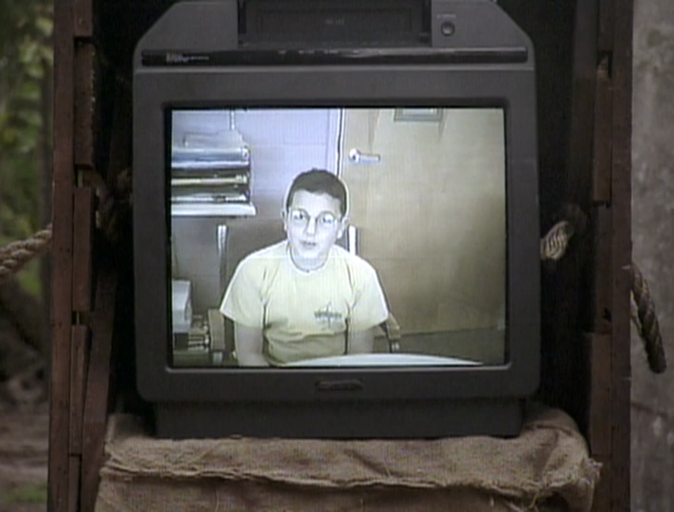 A TV playing a VHS video of a castaway's kid on Survivor: Borneo