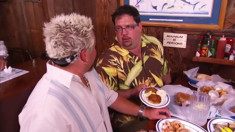 Guy Fieri talking with customer