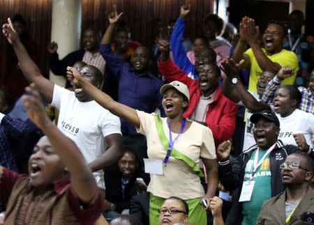 Delegates celebrate after Zimbabwean President Robert Mugabe was dismissed as party leader at an extraordinary meeting of the ruling ZANU-PF's central committee in Harare, Zimbabwe, November 19, 2017. REUTERS/Philimon Bulawayo