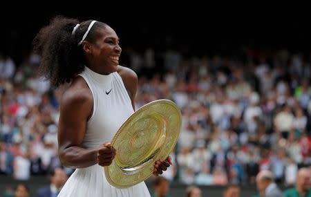 Britain Tennis - Wimbledon - All England Lawn Tennis & Croquet Club, Wimbledon, England - 9/7/16 USA's Serena Williams celebrates winning her womens singles final match against Germany's Angelique Kerber with the trophy REUTERS/Andrew Couldridge
