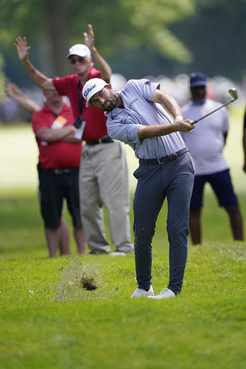 Cameron Young hits off the seventh fairway during the final round of the Rocket Mortgage Classic golf tournament, Sunday, July 31, 2022, in Detroit. (AP Photo/Carlos Osorio)