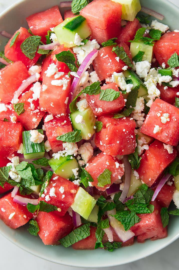 <p>Watermelon + cucumbers is one of the most refreshing combos of all time. Throw in some mint, red onion, and feta and toss it all with a very simple vinaigrette (just olive oil + red wine vinegar), and you've got yourself a mean summer salad. It's the perfect <a href="https://www.delish.com/uk/cooking/recipes/g32708558/vegetarian-side-dishes/" rel="nofollow noopener" target="_blank" data-ylk="slk:summer side;elm:context_link;itc:0;sec:content-canvas" class="link ">summer side</a> to go along <a href="https://www.delish.com/uk/cooking/recipes/a28841199/best-grilled-chicken-breast-recipe/" rel="nofollow noopener" target="_blank" data-ylk="slk:grilled chicken;elm:context_link;itc:0;sec:content-canvas" class="link ">grilled chicken</a> or even a <a href="https://www.delish.com/uk/cooking/recipes/g30993382/best-burger-recipes/" rel="nofollow noopener" target="_blank" data-ylk="slk:hamburger—beef, chicken, or veggie;elm:context_link;itc:0;sec:content-canvas" class="link ">hamburger—beef, chicken, or veggie</a>! </p><p>Get the <a href="https://www.delish.com/uk/cooking/recipes/a32998257/watermelon-salad-feta-mint-recipe/" rel="nofollow noopener" target="_blank" data-ylk="slk:Watermelon Feta Salad;elm:context_link;itc:0;sec:content-canvas" class="link ">Watermelon Feta Salad</a> recipe.</p>