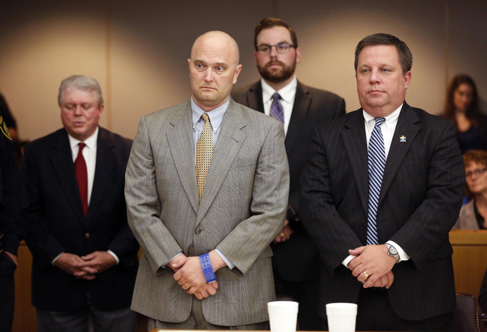 Former Balch Springs Police Officer Roy Oliver, foreground left, stands next to defense attorney Miles Brissette, right, after being sentenced to 15 years in prison for the murder of 15-year-old Jordan Edwards, Wednesday, Aug. 29, 2018, at the Frank Crowley Courts Building, in Dallas. (Rose Baca/The Dallas Morning News via AP, Pool)