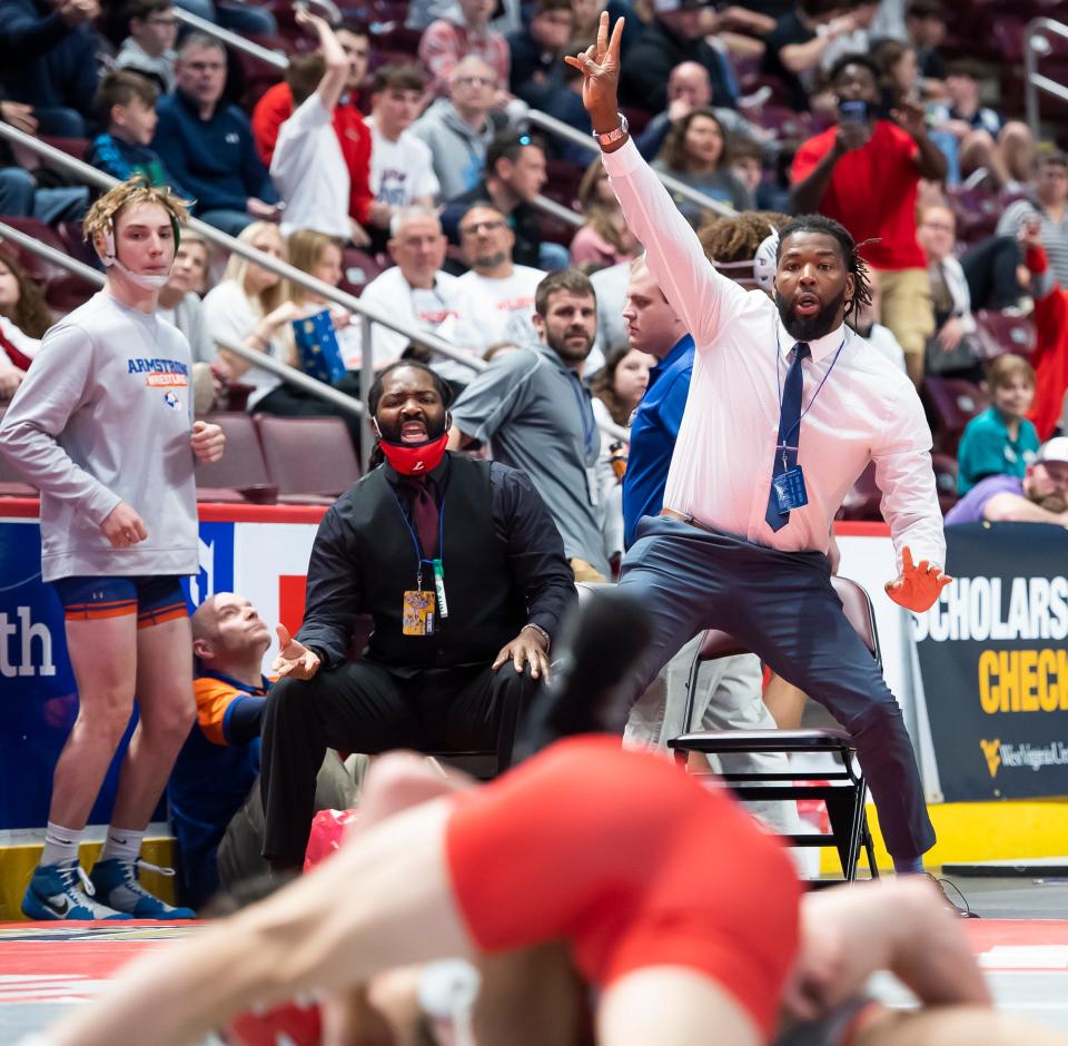 Lebanon coaches react as Griffin Gonzalez scores back points to defeat West Allegheny's Nico Taddy in a 152-pound preliminary bout at the state championships last year. Gonzalez finished in the Class AAA 152-pound weight class, earning a medal.