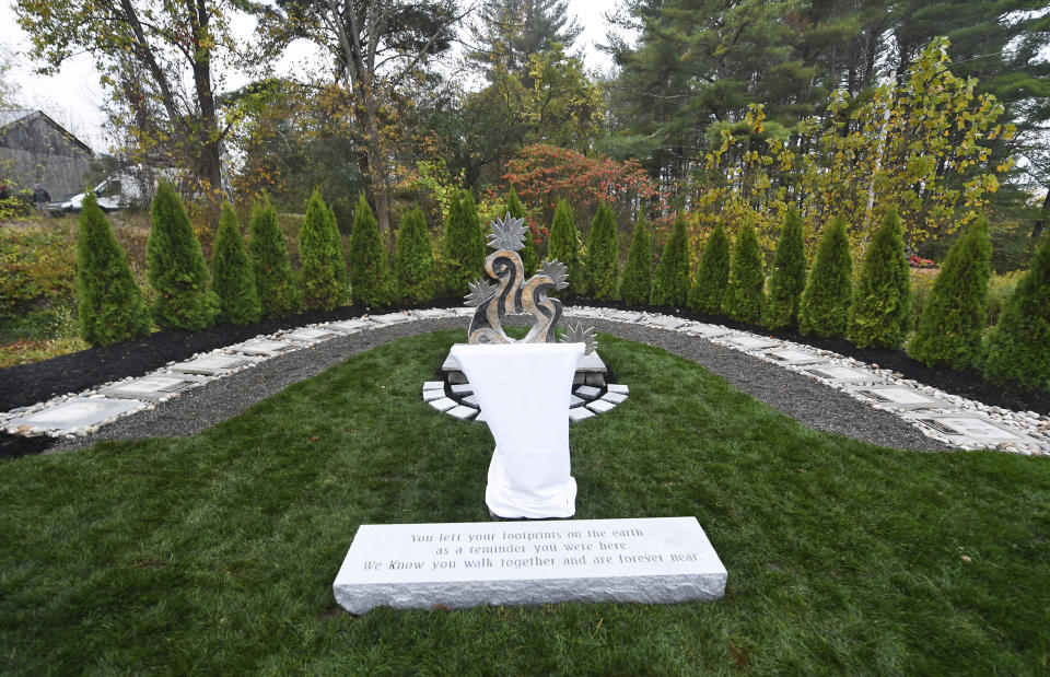 View of the Reflective Memorial before family members, friends and first responders gather for a memorial unveiling ceremony, on the one year anniversary of the Schoharie limousine crash that killed 20 people, Saturday, Oct. 5, 2019, in Schoharie, N.Y. The memorial featuring 20 stones in a semicircle is to be viewed privately by family members and first responders Saturday morning. The public is welcome Sunday. (AP Photo/Hans Pennink)