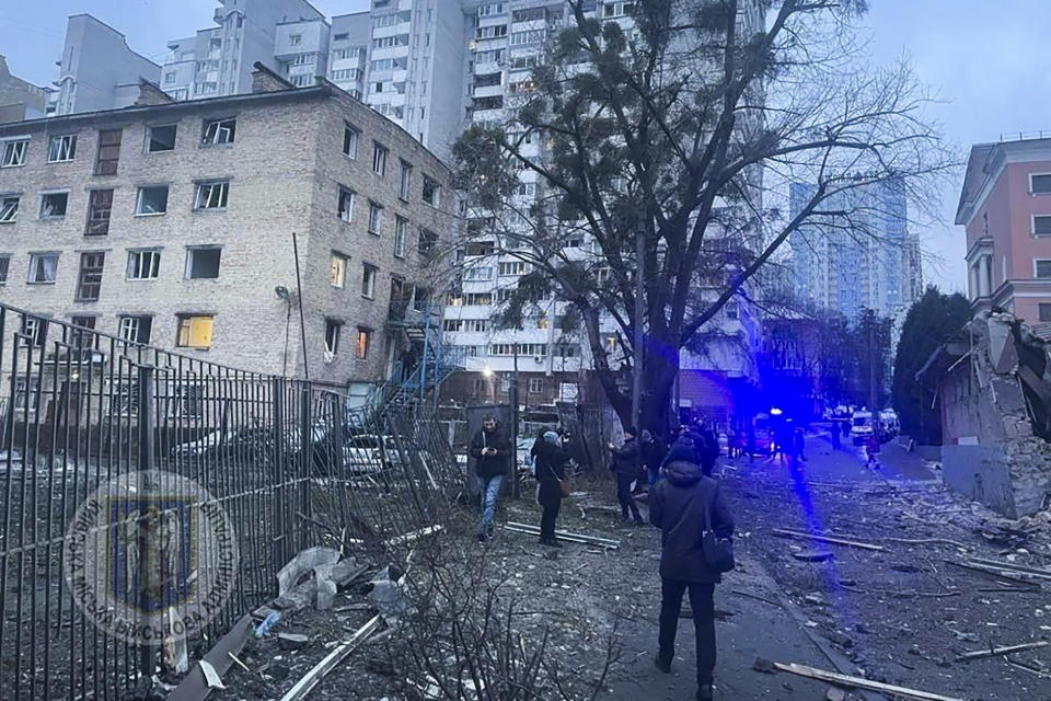 In this photo provided by the Kyiv Regional Military Administration, debris of a destroyed apartment building is seen after a Russian attack in Kyiv, Ukraine, Tuesday, Jan. 23, 2024. (Kyiv Regional Military Administration via AP)