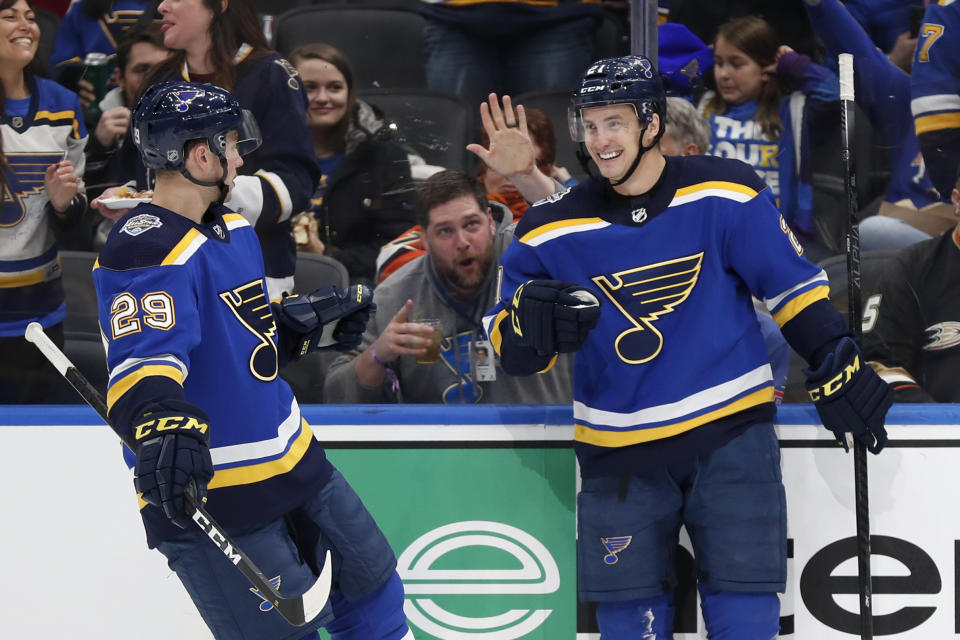 St. Louis Blues' Tyler Bozak, right, is congratulated by Vince Dunn (29) after scoring during the second period of an NHL hockey game against the Anaheim Ducks Monday, Jan. 13, 2020, in St. Louis. (AP Photo/Jeff Roberson)