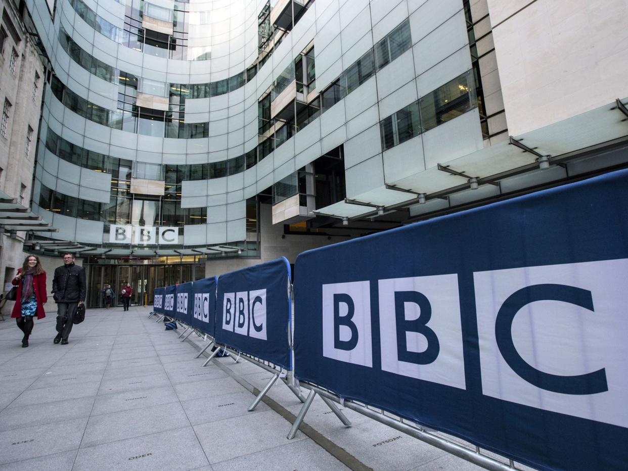 People walk past Broadcasting House, the headquarters of the BBC, on March 25, 2014 in London, England. MPs have today voted in favour of an amendment to the Deregulation Bill which, if passed, will require the Government to conduct a review of punishments for non-payment of a TV licence fee, potentially leading to its decriminalisation: Getty