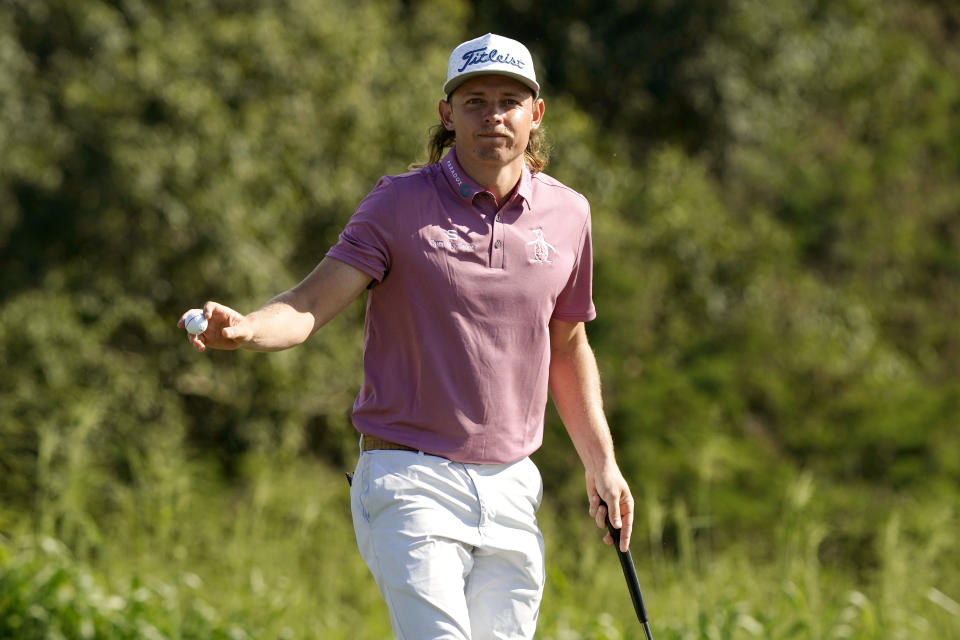 Cameron Smith waves after winning the final round of the Tournament of Champions golf event, Sunday, Jan. 9, 2022, at Kapalua Plantation Course in Kapalua, Hawaii. (AP Photo/Matt York)