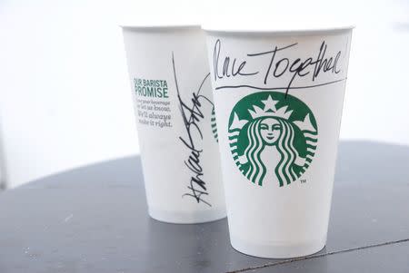 Starbucks baristas were given the option of writing "Race Together" on customers' coffee cups to help initiate dialog amid renewed racial tensions stemming from the shooting of an unarmed black 18-year-old male by a white policeman in August in Ferguson, Missouri. REUTERS/Starbucks/Handout