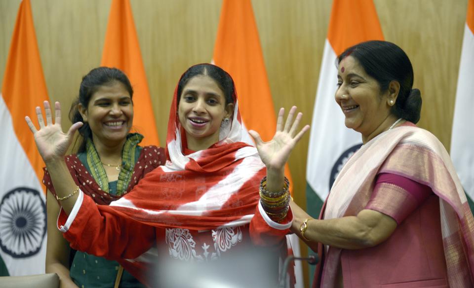 'Geeta' is embraced by Sushma Swaraj after a press conference in New Delhi on October 26, 2015. (Photo by Yasbant Negi/The India Today Group via Getty Images)