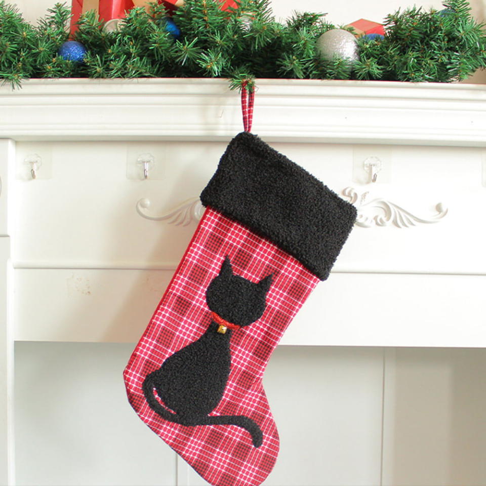 <p><a href="https://go.redirectingat.com?id=74968X1596630&url=https%3A%2F%2Fwww.walmart.com%2Fip%2FChristmas-Cat-Stockings-Creative-Plaid-Black-Cat-Christmas-Stocking-Bag-Xmas-Tree-Hanging-Candy-Gift-Bag-for-Home-Holiday-Xmas-Party-Decorations%2F1667541360&sref=https%3A%2F%2Fwww.womansday.com%2Flife%2Fpet-care%2Fg45560286%2Fbest-cat-christmas-stocking%2F" rel="nofollow noopener" target="_blank" data-ylk="slk:Shop Now;elm:context_link;itc:0;sec:content-canvas" class="link ">Shop Now</a></p><p>Christmas Cat Stocking</p><p>walmart.com</p><p>$9.57</p>