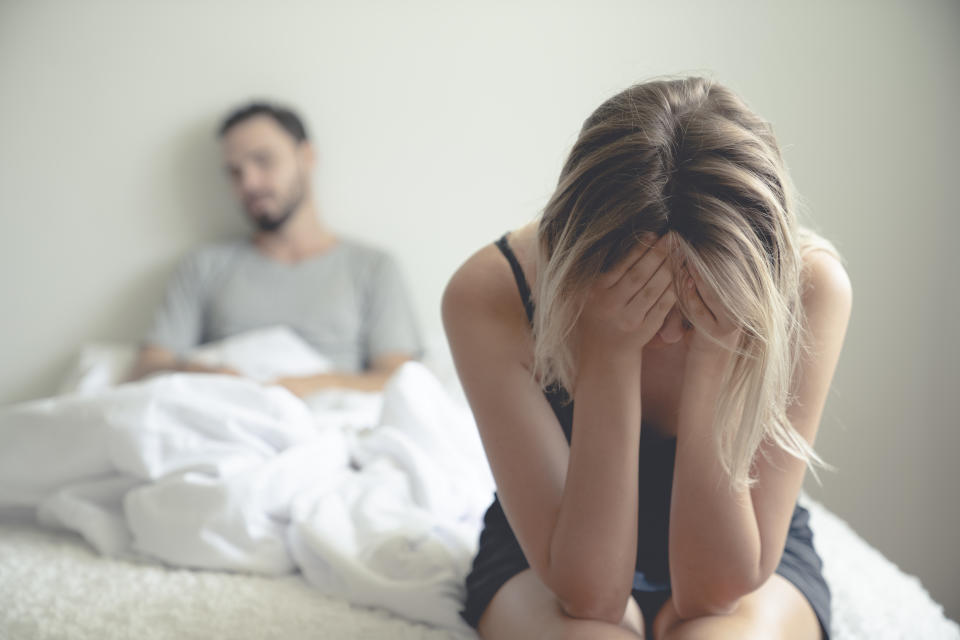 Frustrated sad girlfriend sit on bed think of relationship problems