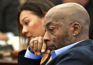 In this July 9, 2018, file photo, Plaintiff Dewayne Johnson, right, reacts while attorney Brent Wisner, not seen, speaks about his condition during the Monsanto trial in San Francisco. Monsanto is being accused of hiding the dangers of its popular Roundup products. A San Francisco jury on Friday, Aug. 10, 2018, ordered agribusiness giant Monsanto to pay $289 million to a former school groundskeeper dying of cancer, saying the company's popular Roundup weed killer contributed to his disease. The lawsuit brought by Johnson was the first to go to trial among hundreds filed in state and federal courts saying Roundup causes non-Hodgkin's lymphoma, which Monsanto denies. (Josh Edelson/Pool Photo via AP, File)