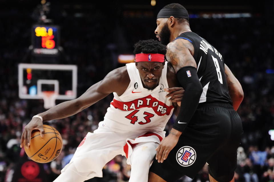 Toronto Raptors forward Pascal Siakam (43) drives against Los Angeles Clippers forward Marcus Morris Sr. (8) during the second half of an NBA basketball game Tuesday, Dec. 27, 2022, in Toronto. (Frank Gunn/The Canadian Press via AP)