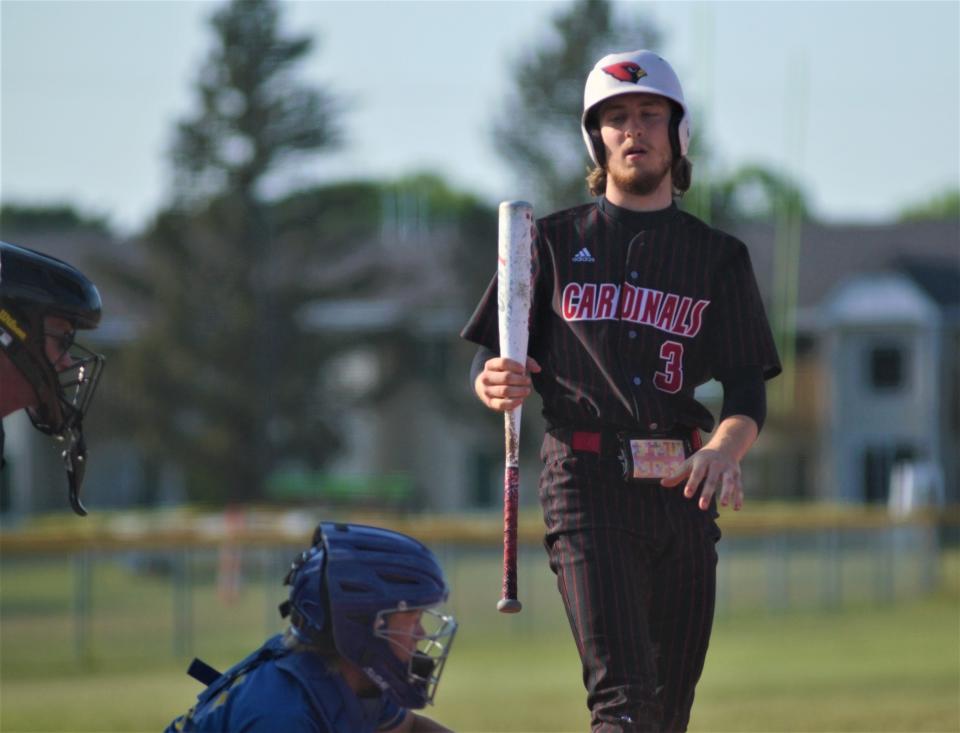 Thomas Fox steps out of the batter's box during an MHSAA district baseball matchup between Johannesburg-Lewiston and Mio on Tuesday, May 30 in Gaylord, Mich.