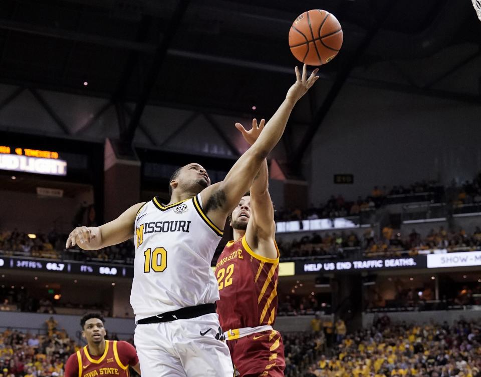 Missouri Tigers guard Nick Honor (10) shoots a layup against Iowa State Cyclones guard Gabe Kalscheur (22) during the first half at Mizzou Arena.