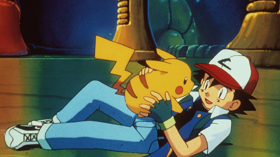 Pikachu (left) has a yellow tail with a bit of brown fur at its base — there is no black stripe. The Pokémon character is seen with Ash in 1999's "Pokemon: The First Movie." - Getty Images