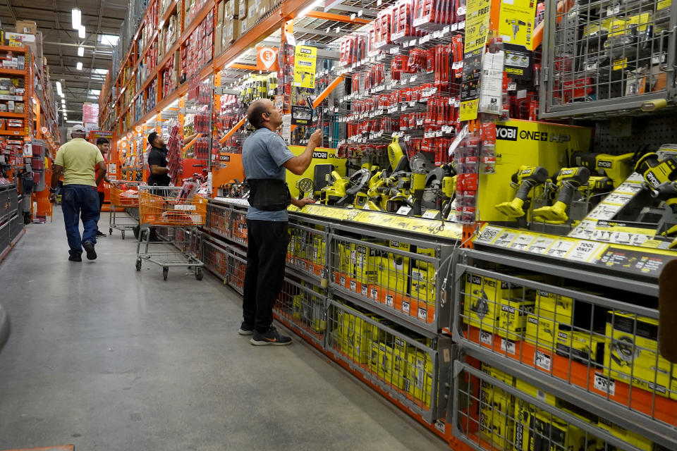 MIAMI, FLORIDA - NOVEMBER 14: Customers shop at a Home Depot store on November 14, 2023 in Miami, Florida. Home Depot announced that comparable store sales in the U.S. declined 3.5 percent in the quarter ending October 29 compared with a year earlier. Net income fell 12 percent, which was better than the 15 percent decline analysts expected. (Photo by Joe Raedle/Getty Images)