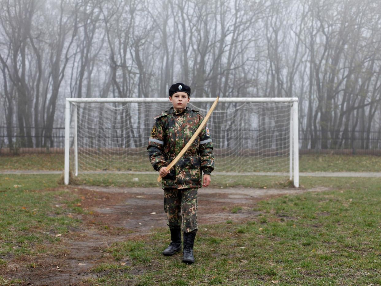 A cadet holds a model of a sword as he trains at the stadium of the General Yermolov Cadet School in Stavropol, Russia: Reuters