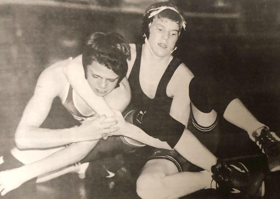 Milbank's 103-pounder Jesse Krause wraps up Webster's Nathan Nilson during their Northeast Conference wrestling dual in the winter of 1995.