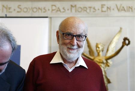 Belgian physicist Francois Englert arrives at a news conference at the University of Brussels October 8, 2013. REUTERS/Francois Lenoir