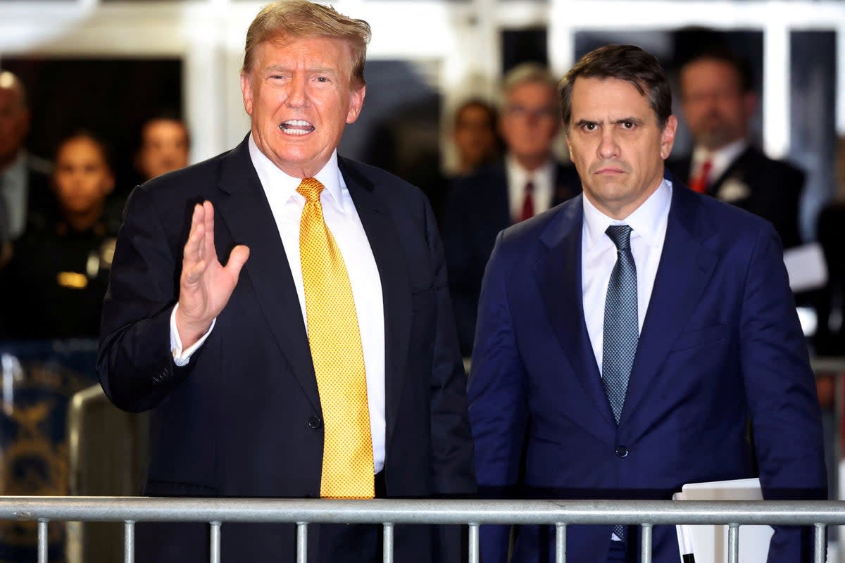 Former US president Donald Trump speaks alongside his attorney Todd Blanche during his hush money trial at Manhattan Criminal Court on May 21 2024 (via REUTERS)