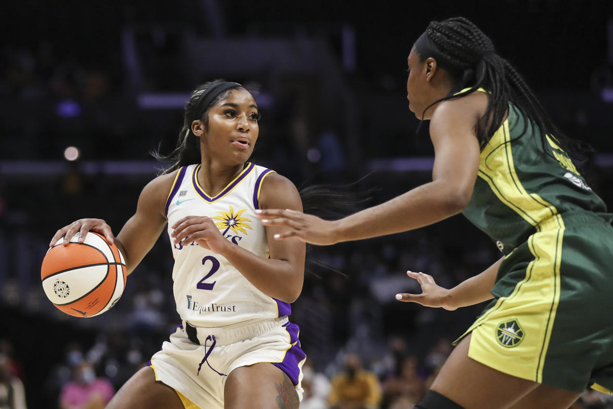 LOS ANGELES, CALIFORNIA - SEPTEMBER 12: Guard Te'a Cooper #2 of the Los Angeles Sparks handles the ball defended by forward Kennedy Burke #8 of the Seattle Storm at Staples Center on September 12, 2021 in Los Angeles, California. NOTE TO USER: User expressly acknowledges and agrees that, by downloading and or using this photograph, User is consenting to the terms and conditions of the Getty Images License Agreement. (Photo by Meg Oliphant/Getty Images)