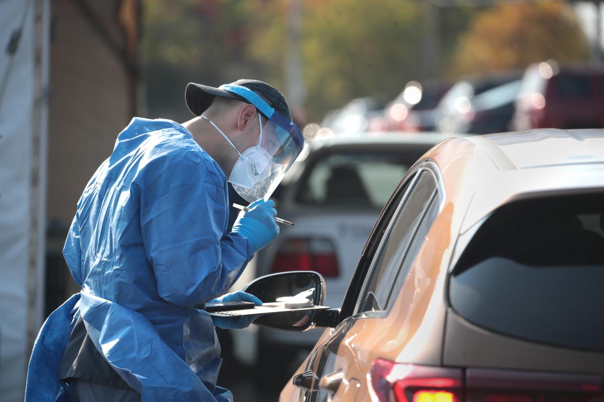 Members of the Wisconsin National Guard test residents for the coronavirus Covid-19 in Wisconsin on 9 October. (Getty Images)