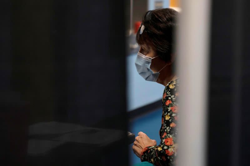 People from rural communities get their coronavirus disease (COVID-19) vaccinations at Menominee Indian High School in Menominee, Wisconsin