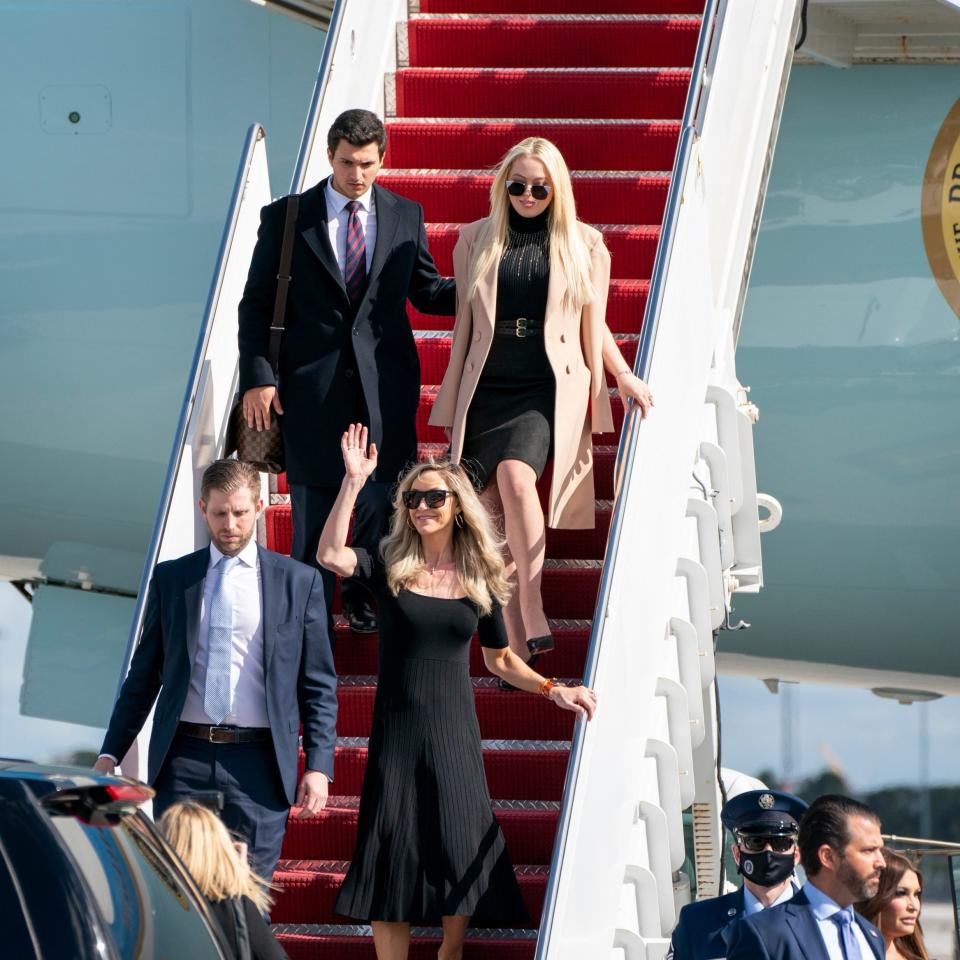 Tiffany Trump with her finance, Michael Boulos, top, and Eric Trump and his wife Lara Trump and Donald Trump Jr., and his girlfriend Kimberly Guilfoyle, bottom right, arrive at Palm Beach International Airport  - AP