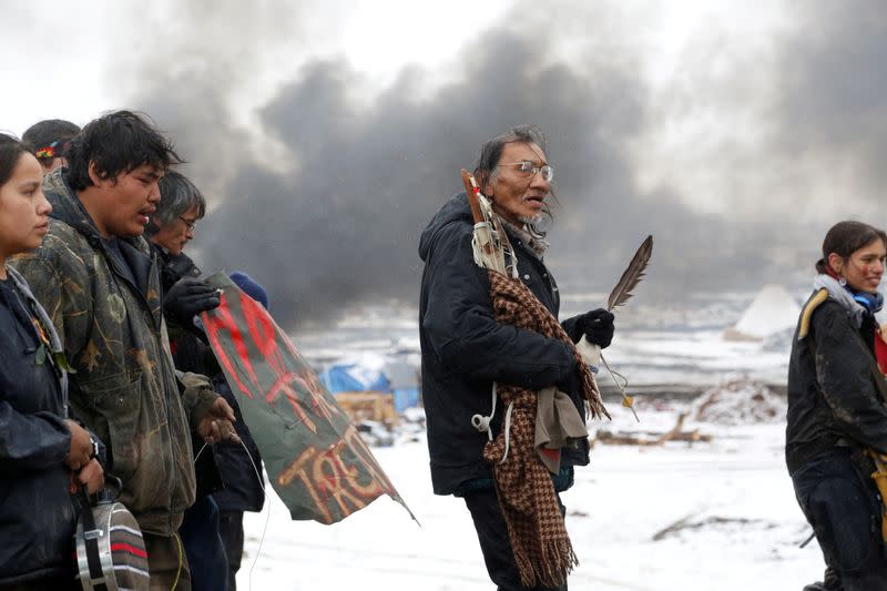 FILE PHOTO: Nathan Phillips marches with other protesters out of the main opposition camp against the Dakota Access oil pipeline near Cannon Ball