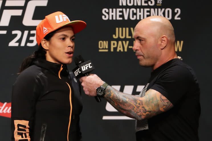 UFC women’s bantamweight champion Amanda Nunes, being interviewed Friday at the weigh-in by Joe Rogan, fell ill and was pulled from her scheduled bout Saturday against Valentina Shevchenko. (Getty Images)