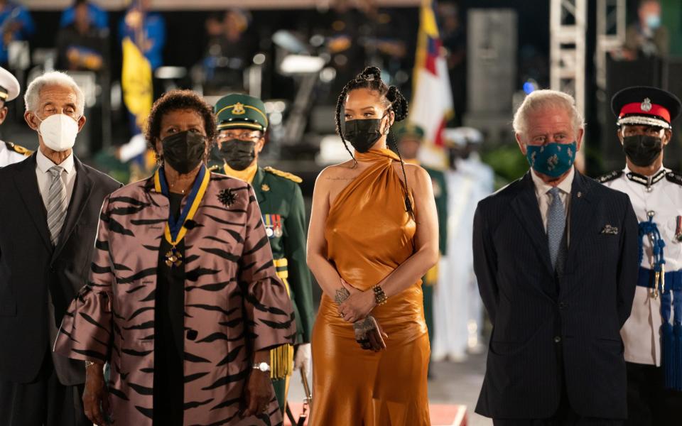 (L-R) Former cricketer Garfield Sobers, new President Sandra Mason, singer Rihanna and the Prince of Wales stand during the ceremony - Arthur Edwards/Pool